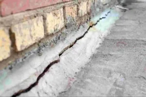 Professional Foundation Repair addressing basement wall cracks, structural movement, and settlement to stabilize a residential home's foundation.