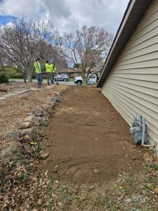 Basement waterproofing process in spring showing specialists preventing winter water damage for homeowners.